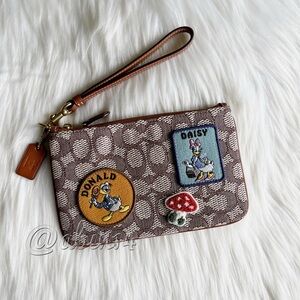 Coach x Disney Jacquard and Leather Wristlet with Disney patches